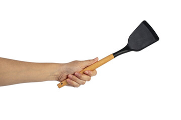 Hand with Black plastic kitchen spatula, kitchenware for cooking on transparent background.