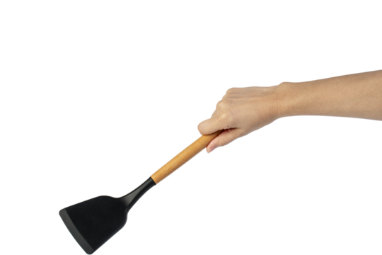 Hand with Black plastic kitchen spatula, kitchenware for cooking on transparent background.