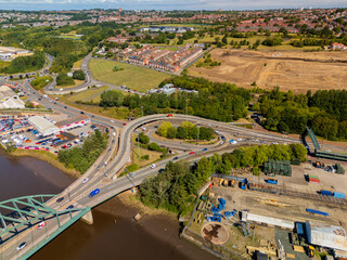 Newcastle upon Tyne UK: 15th Aug 2025: Scotswood bridge roundabout with big outdoor car showroom on the A695 drone view next to the river Tyne in Newcastle