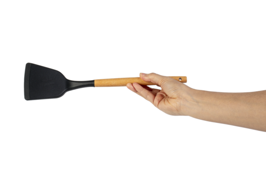 Hand with Black plastic kitchen spatula, kitchenware for cooking on transparent background.