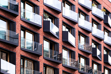 A structured geometric facade reflects modern residential architecture in HafenCity as housing surfaces combine clean lines and depth across Hamburg Germany shaped by contemporary design