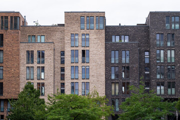 Modern residential architecture rises in HafenCity featuring a geometric facade and layered structure elements shaping housing identity throughout Hamburg Germany through contemporary design