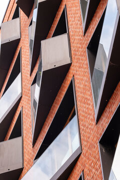 Geometric facade intersections enhance modern architecture in HafenCity presenting strong structure elements across Hamburg Germany as residential housing embodies refined contemporary design