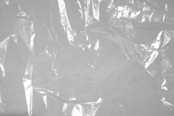 Transparent plastic wrap texture overlay effect. polyethylene wrapping stretch film background. Shrink crumpled plastic sleeve surface.