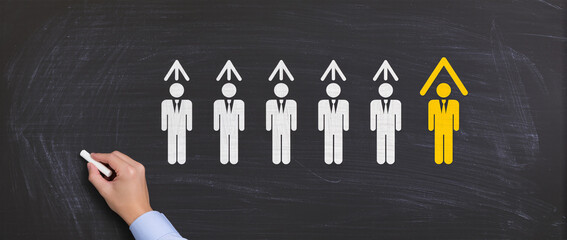 Business leadership skills and development concept Drawing businesspeople and growth arrows on chalkboard