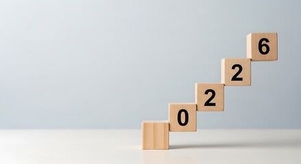 Conceptual arrangement of wooden blocks spelling out 2026, symbolizing future growth, goals, and progressive planning