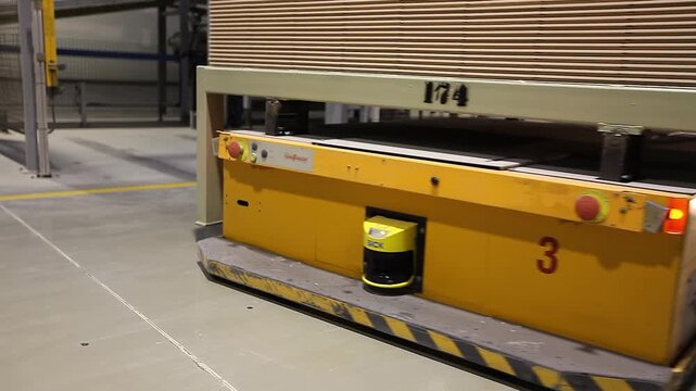 Automated production line of a ceramic tile and porcelain tile plant. Automatic laser guided vehicle (LGV) for handling. Ceramic tile manufacturing plant. Smart Industry. Interior. 
