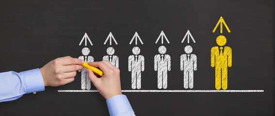 Business leadership skills and development concept Drawing businesspeople and growth arrows on chalkboard