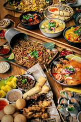 many different thai food dishes on table in modern restaurant in bangkok thailand