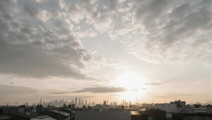 Fototapeta premium Expansive Cloudy Sky During a Golden Sunset Over an Urban Industrial Landscape.