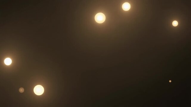 Abstract glowing orbs scattered across a dark background, creating a sense of mystery and ethereal light.