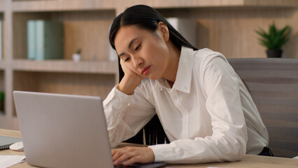 Lazy bored sad Asian Japanese businesswoman female girl upset Chinese Korean business woman worker employer CEO boring online work laptop pc boredom mental health overworked problem burnout in office
