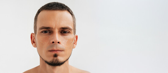 Portrait of a man using under-eye cosmetic patches