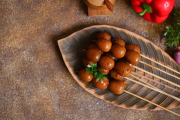 Sweet quail egg satay on a plate 