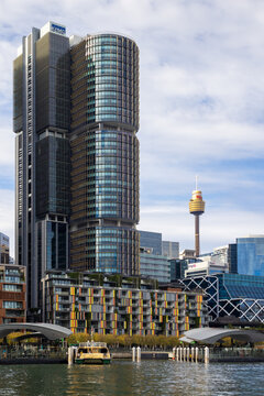 Skyscrapers of Sydney, Australia. One of the International Towers, a modern office complex, and the Sydney Tower Eye, seen from Darling Harbour. June 11, 2024