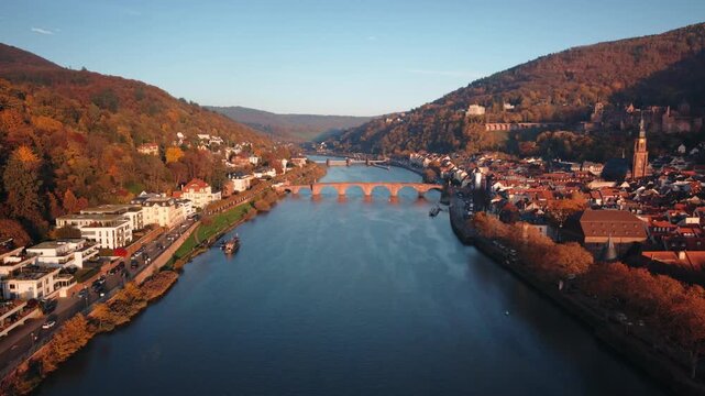 Cinematic Drone Orbit of the Karl Theodor Bridge and Heidelberg Castle with Autumn Old Town Backdrop