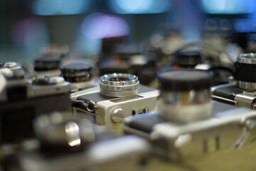 Retro film camera, close-up, back view, on black background.