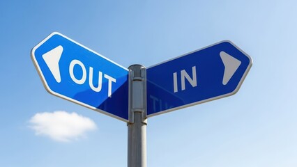 Fototapeta premium Blue two-way signpost 'OUT' left, 'IN' right, under a clear sky, indicating choices