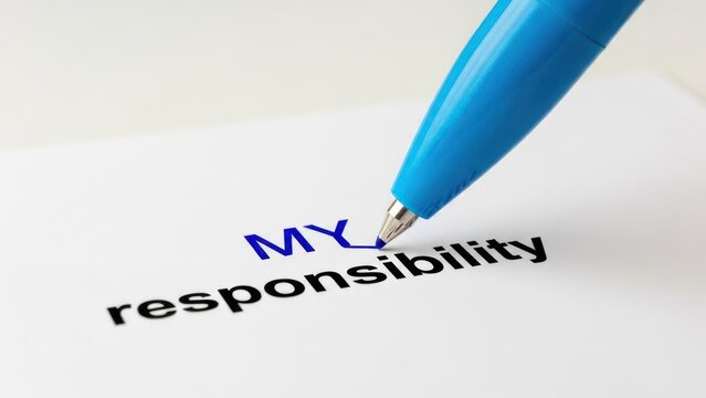 Blue pen tip writing 'MY' on white paper, completing 'MY responsibility' text