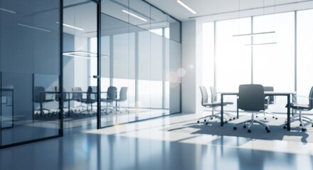 Bright, modern office with glass walls, meeting tables, and ergonomic chairs under natural light