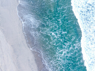 Drone Shot Of Ocean Waves And Beach Boundary.