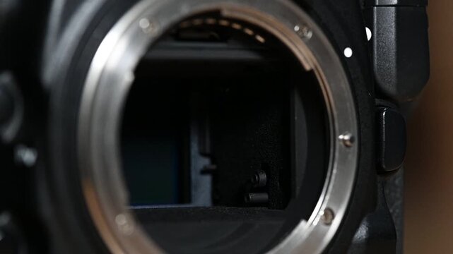 DSLR camera taking photo, creating a distinct mirror slap and mechanical clicking sound.