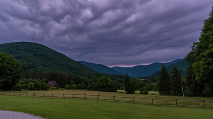 Obraz premium midgard. Dark purple storm clouds gathering before rainfall, dramatic sky formation, natural weather phenomenon. travel magazines, destination branding, designed for travel destination branding.