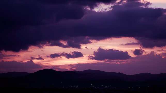 midgard. Dark purple storm clouds gathering before rainfall, dramatic sky formation, natural weather phenomenon. travel magazines, destination branding, designed for travel destination branding.