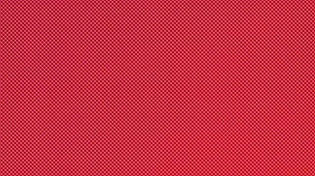 A textured background featuring a vibrant red color with a geometric pattern of small circles.