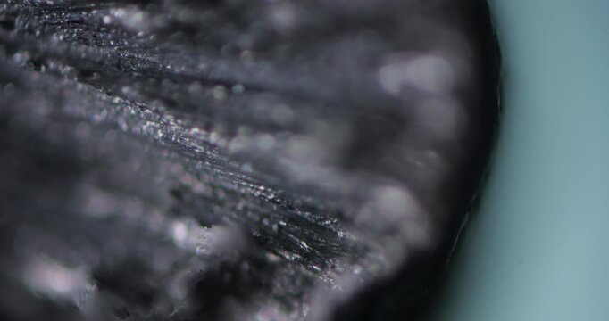 Zinc Drop under Microscope Smooth Focus Magnification 100x, Visible Surface Texture Metallic Shine, Chemical Laboratory Research Science, Scientific Metallurgy Material Analysis Detailed View