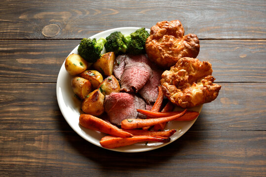 Sunday Roast with roasted beef, carrots, crispy potato, broccoli and yorkshire pudding