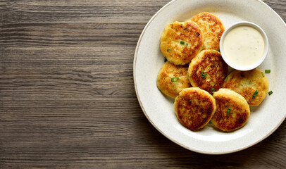 Potato pancakes made from mashed potato and minced fish served with sauce