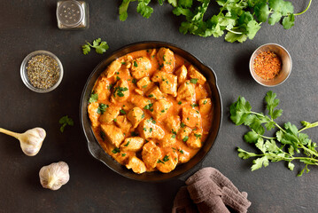 Delicious chicken tikka masala curry in cast iron pan