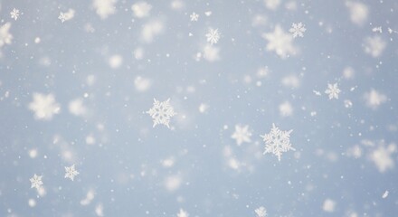 Fototapeta premium Numerous detailed white snowflakes falling against a soft, light blue winter background