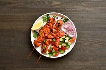 Tandoori skewers are marinated in spices, yogurt and lemon juice