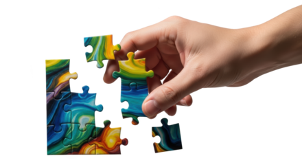 Hand placing a colorful puzzle piece to complete a jigsaw concept visualized beautifully with focus on