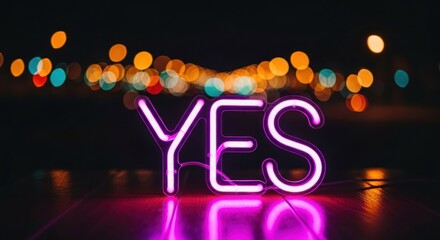 Vibrant pink 'YES' neon sign illuminates dark surface with abstract urban lights