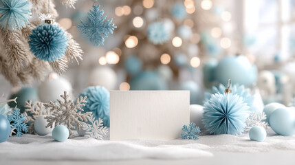 Winter holiday card with blue and white snowflake decorations and baubles on snowy surface with soft bokeh lights