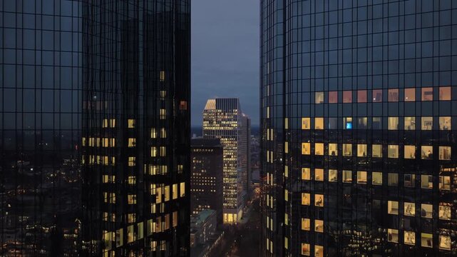 Aerial night view of Frankfurt skyline with impressive skyscrapers and bank district. Revealing shot of german financial hub