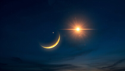 Crescent moon and bright star in a dark night sky.
