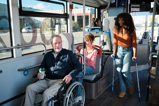Diverse passengers using public transport with disabilities - Powered by Adobe