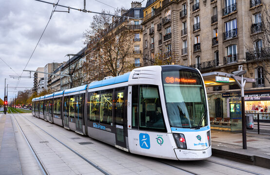 Paris, France - December 3, 2025: Alstom Citadis tram arrives at Porte de Saint-Ouen station. Modern T3b line vehicle connects the 17th and 18th arrondissements of Paris in Ile-de-France region