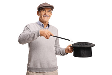Elderly man holding a magician hat and wand