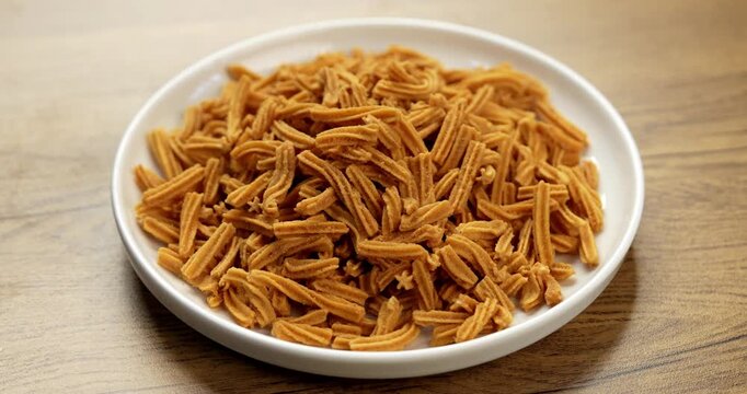 Crispy soya stick snack served in a bowl, healthy high-protein Indian namkeen for tea time or evening munching