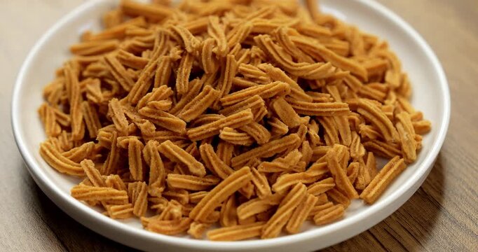 Crispy soya stick snack served in a bowl, healthy high-protein Indian namkeen for tea time or evening munching
