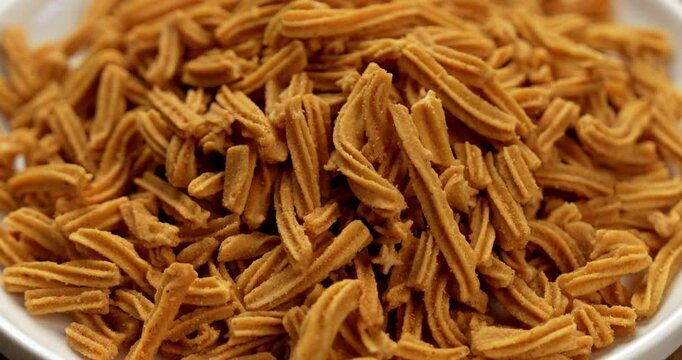 Crispy soya stick snack served in a bowl, healthy high-protein Indian namkeen for tea time or evening munching