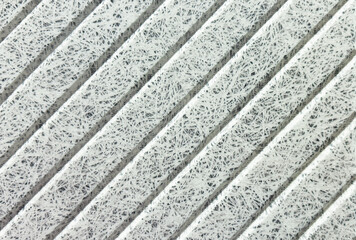 Recycle material finishing wall with vertical grooves 45 degree pattern texture background.