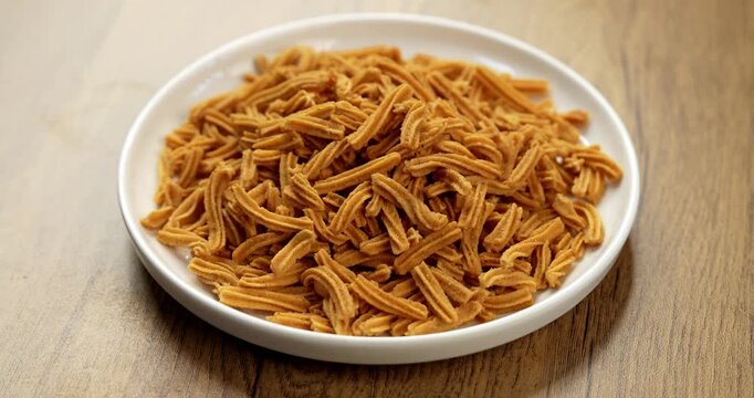 Crispy soya stick snack served in a bowl, healthy high-protein Indian namkeen for tea time or evening munching