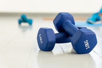 Blue Dumbbells on Exercise Mat Outdoors