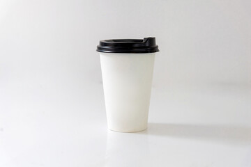 paper coffee cup with lid on white background 